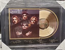 Framed gold record displayed beside the Queen Queen II album cover with a laser-reproduced signature, offered as a charity auction lot